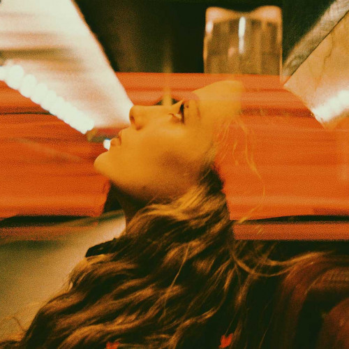 woman looking up in sky